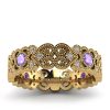 Wzorzyste piękno - Ażurowy pierścionek z żółtego złota z tanzanitami i diamentami